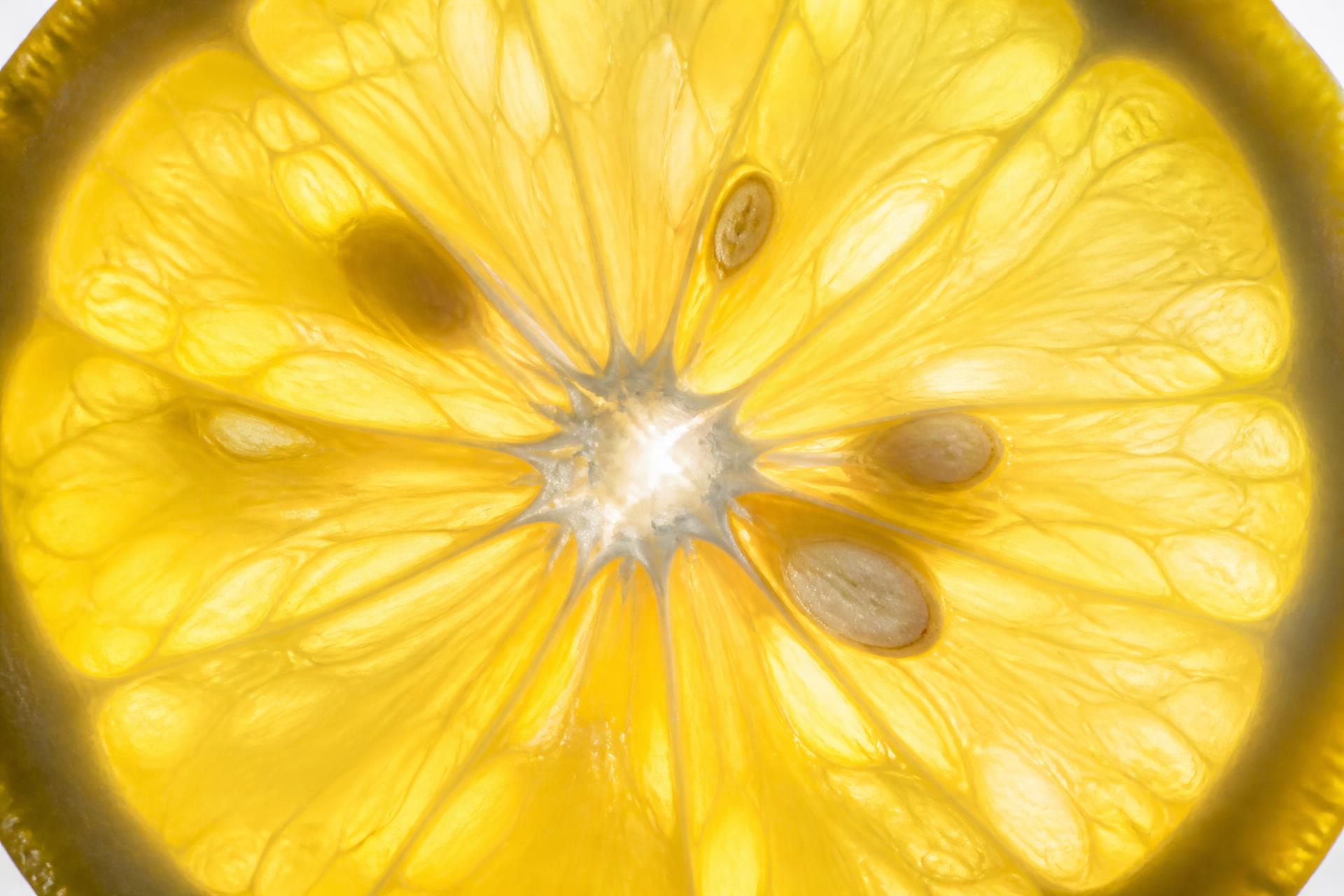 Macro photograph of fresh yuzu citrus and translucent segments